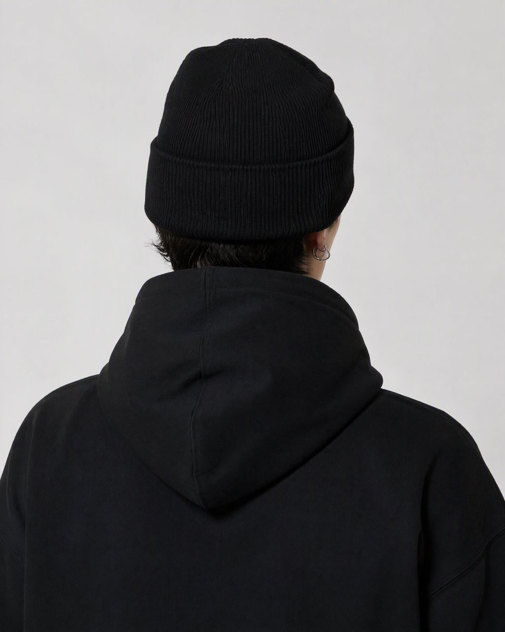 BLACK ORBIT BEANIE — worn, back view