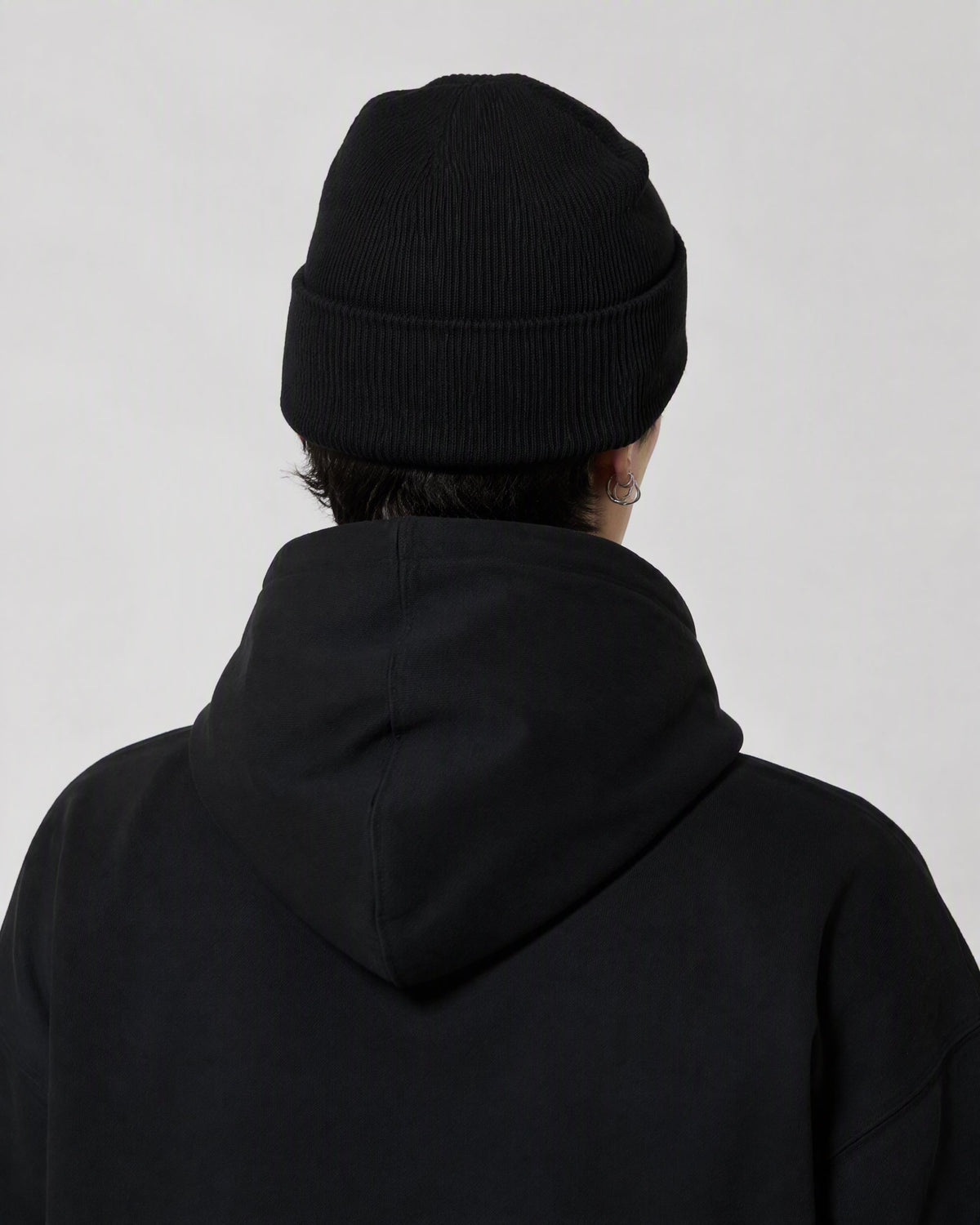 BLACK ORBIT BEANIE — worn, back view
