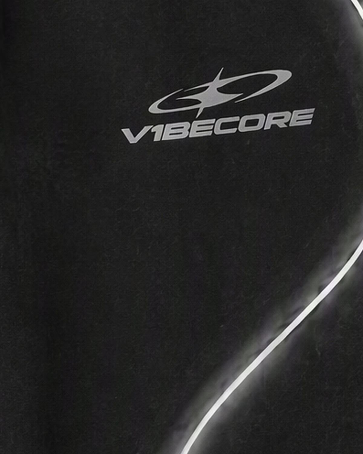BLACK ORBIT JOGGER — embroidered logo close-up