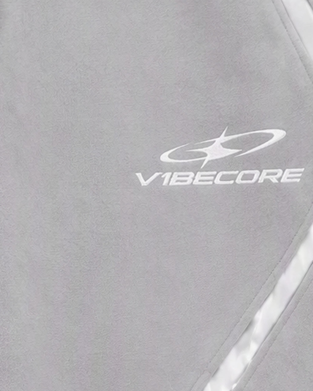 GREY ORBIT JOGGER — embroidered logo close-up