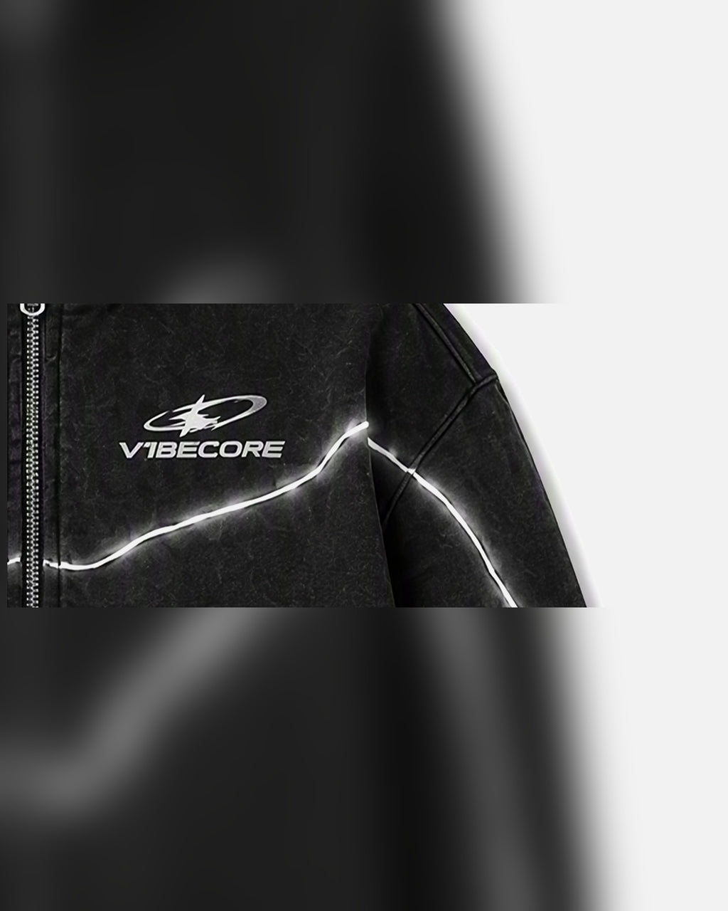BLACK ORBIT ZIP — embroidered logo close-up